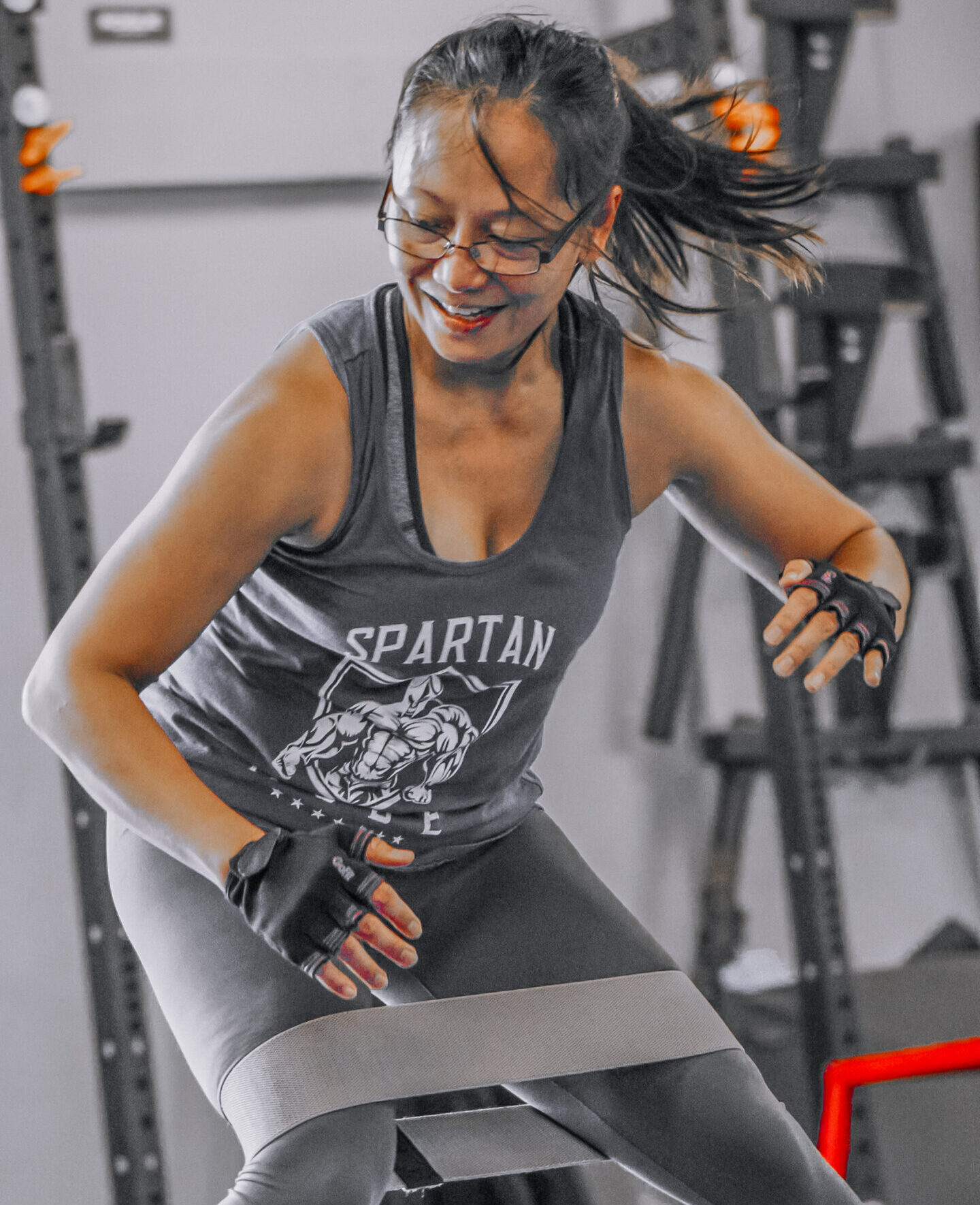 Woman doing exercise with resistance bands at DNA Fitness Club